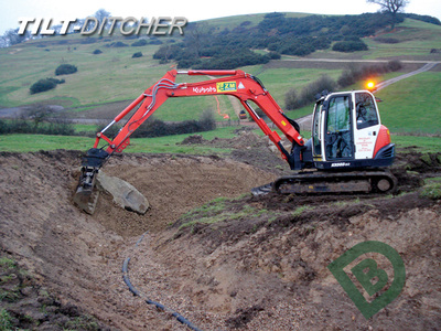 Creating berms and batters with an excavator Tilt-Ditcher