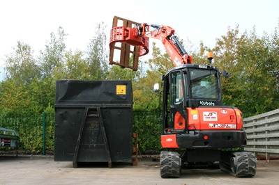 Waste handling with an excavator rotary selector grab.